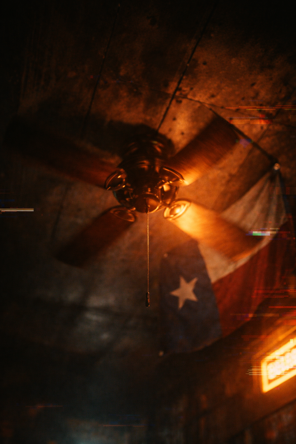 The ceiling fan at two o'clock — the wobble that never degrades